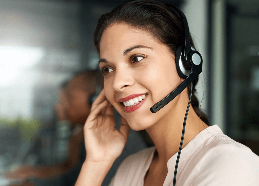a woman wearing a headset talking to a patient
